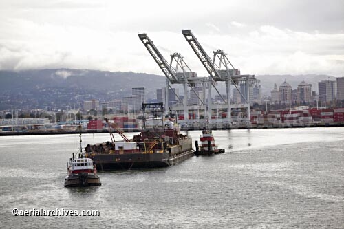 © aerialarchives.com, tug boats manuevering a barge out of the Outer Harbor of the Port of Oakland with the City of Oakland in the background   aerial photograph, aerial photography
AHLB2007.jpg