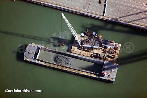 © aerialarchives.com, dredging the Outer harbor of the Port of Oakland,
dredged sediment is loaded onto a barge for disposal  aerial photograph, aerial photography, AN6WYX
AHLB2010