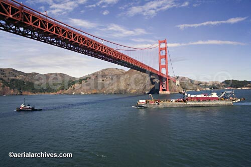 © aerialarchives.com, aerial photograph of a tug boat pulling a barge under the Golden Gate bridge, 
AHLB2120.jpg