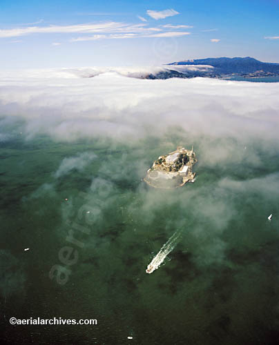 aerialarchives.com a ferry leaves Alcatraz island in the fog, aerial photography aerial  AHLB2354