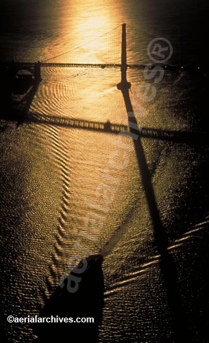 © aerialarchives.com aerial photograph of a containership entering San Francisco Bay at sunset with the Golden Gate bridge and the long shadow of the south tower of the Golden Gate bridge, 
AHLB2127.jpg