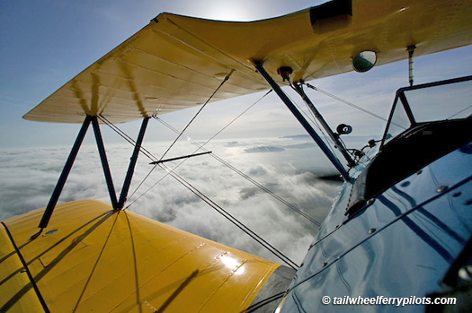 Stearman in flight ferry pilot Herb Lingl  AHLC5140